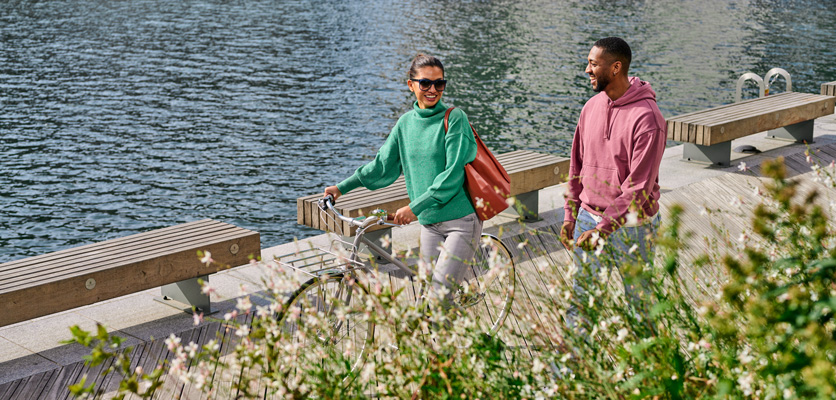 Strolling and chatting along the river in the wharf