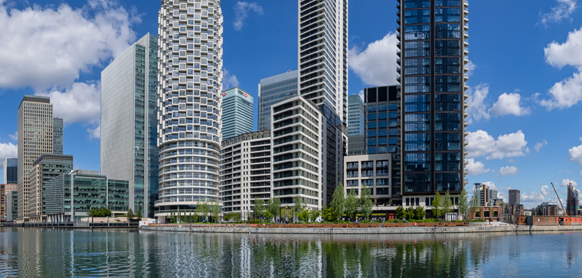 Tall skyline buildings along the river