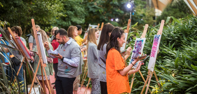 People having fun painting outside